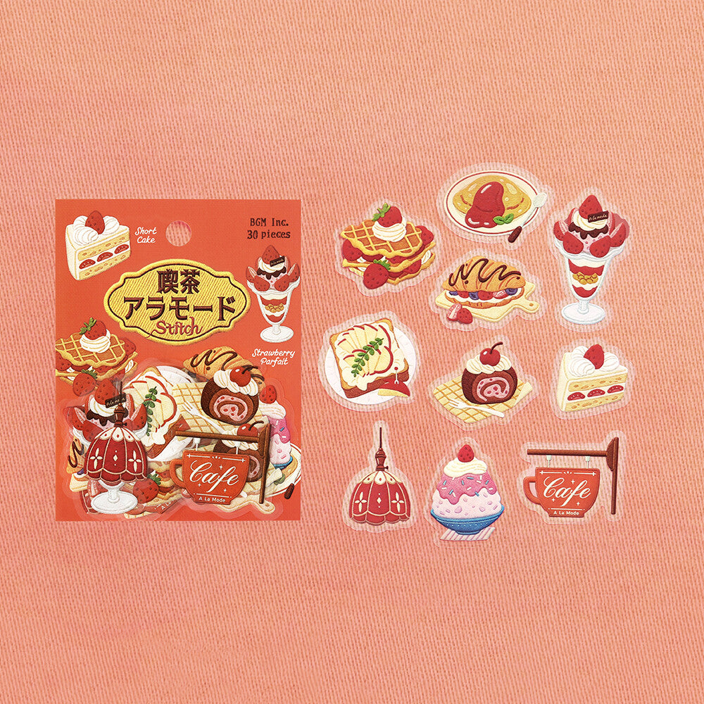 A sheet of 30 Japanese sweets and desserts stickers displayed next to their red-orange packaging box on a textured pink background. The stickers feature illustrations of various desserts like strawberry cake, chocolate cream pie, and ice cream.