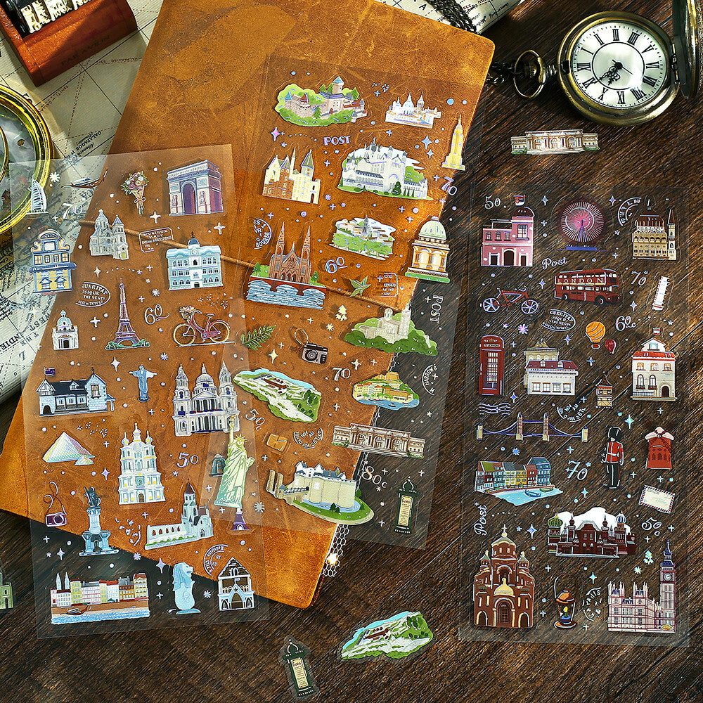3 Sheets of decorative stickers with a travelers notebook in the background