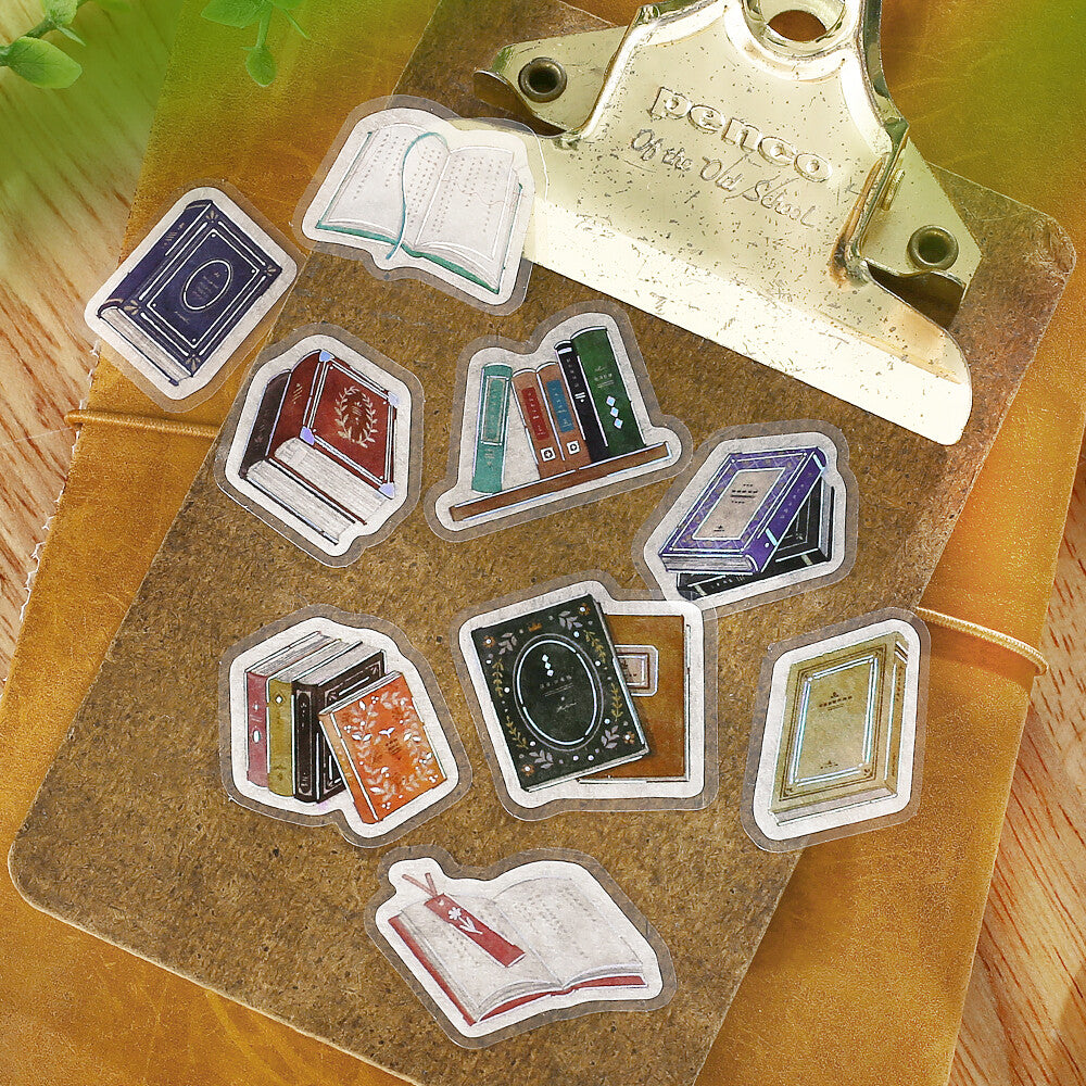 Set of book-shaped stickers on a clipboard with a vintage feel.