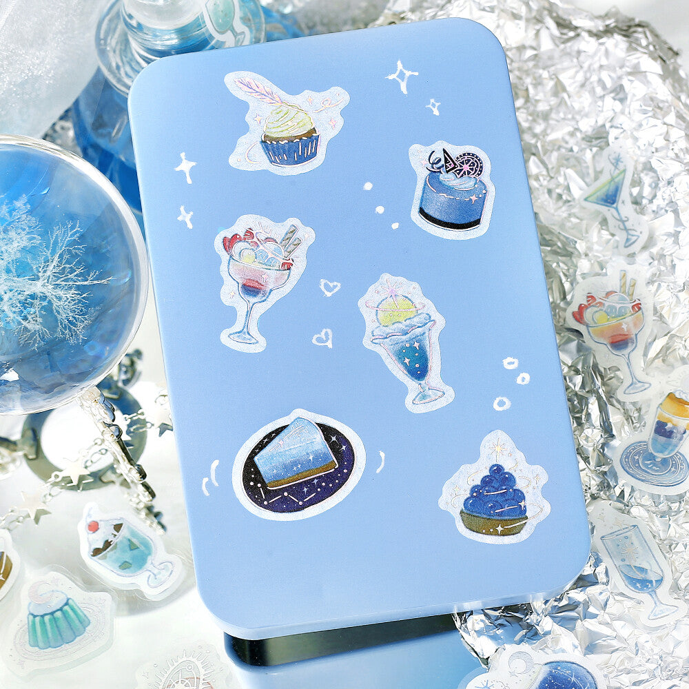 Blue phone case with ice cream and snow globe stickers on a glittery background