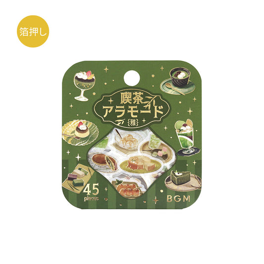 Packaging with illustrations of Japanese sweets and tea, featuring text and a green background.