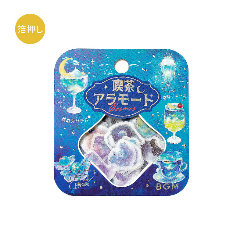 A packaged set of iridescent gel discs in a blue starry card sleeve with Japanese text, shown on a plain white background. The package includes illustrated cocktail glasses and a teacup, and a small yellow circular label with Japanese text appears in the top-left corner.