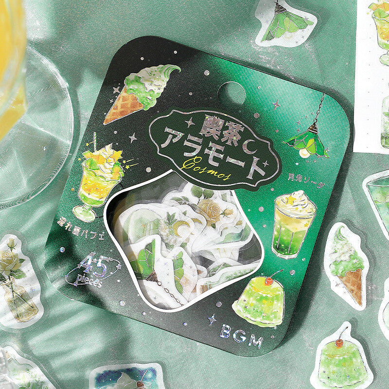 Pack of stickers with green and white designs on a green background