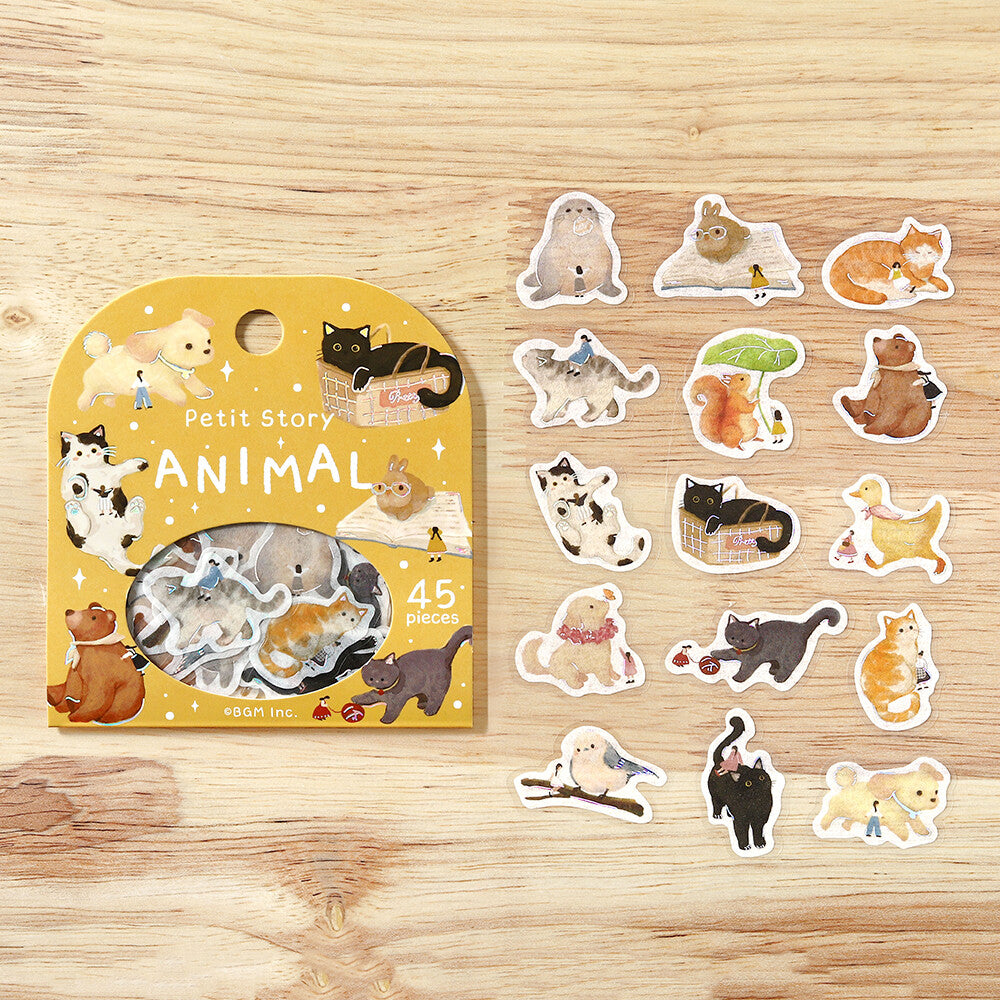 Set of animal-themed stickers with packaging on a wooden surface