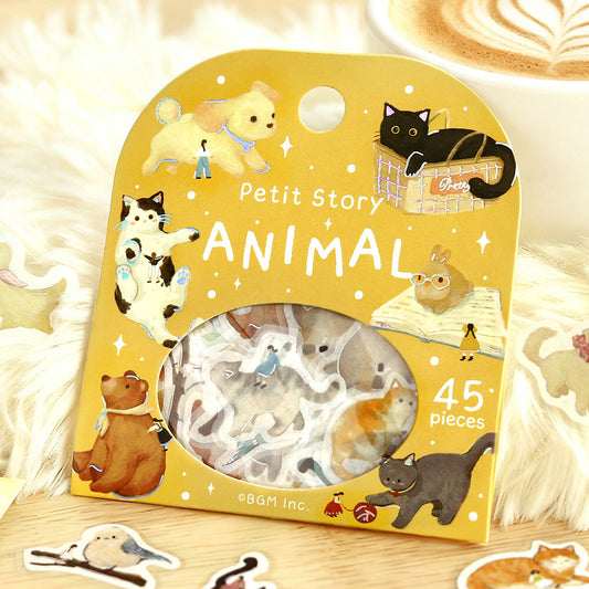 Packaging of Petit Story animal stickers with illustrations on a wooden surface
