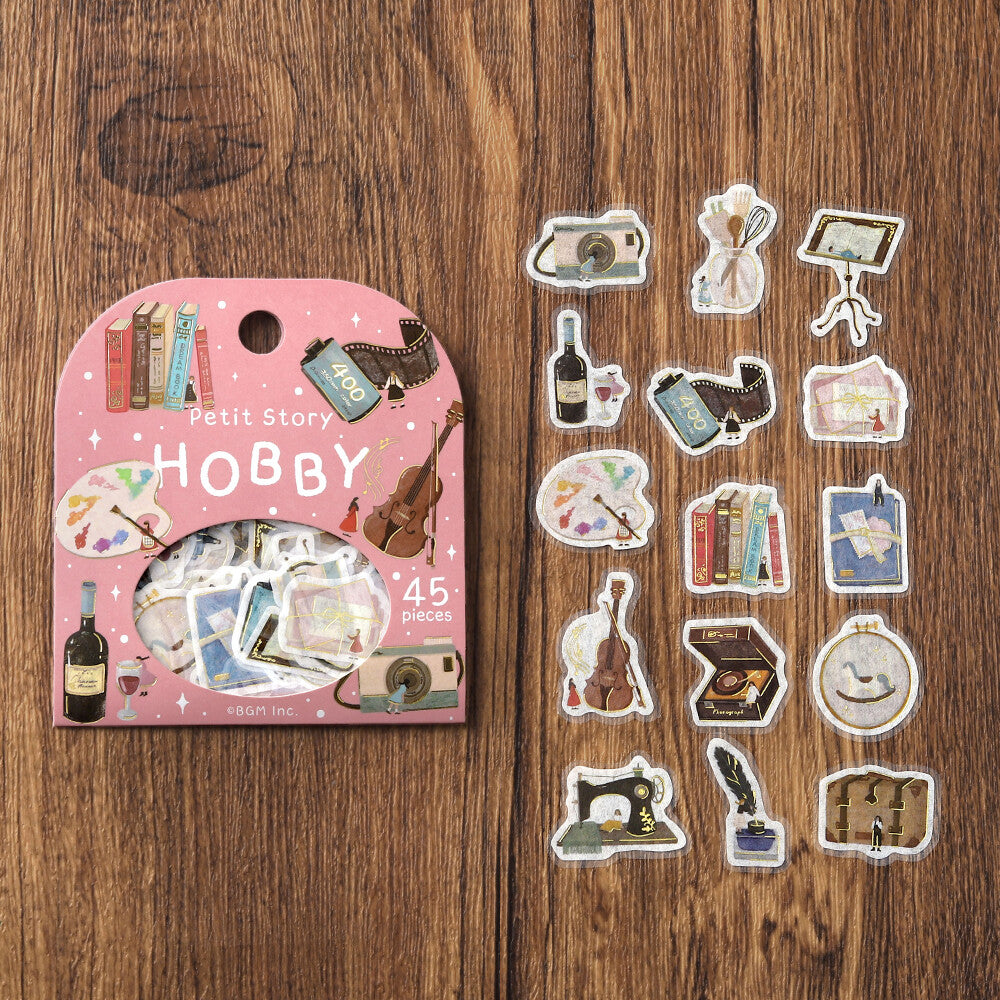 Pack of 'Petit Story Hobby' stickers on a wooden surface