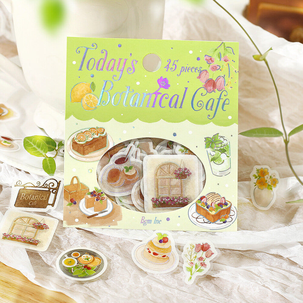 Packaging of 'Today's Botanical Cafe' stickers with illustrations of food and nature on a white fabric background.
