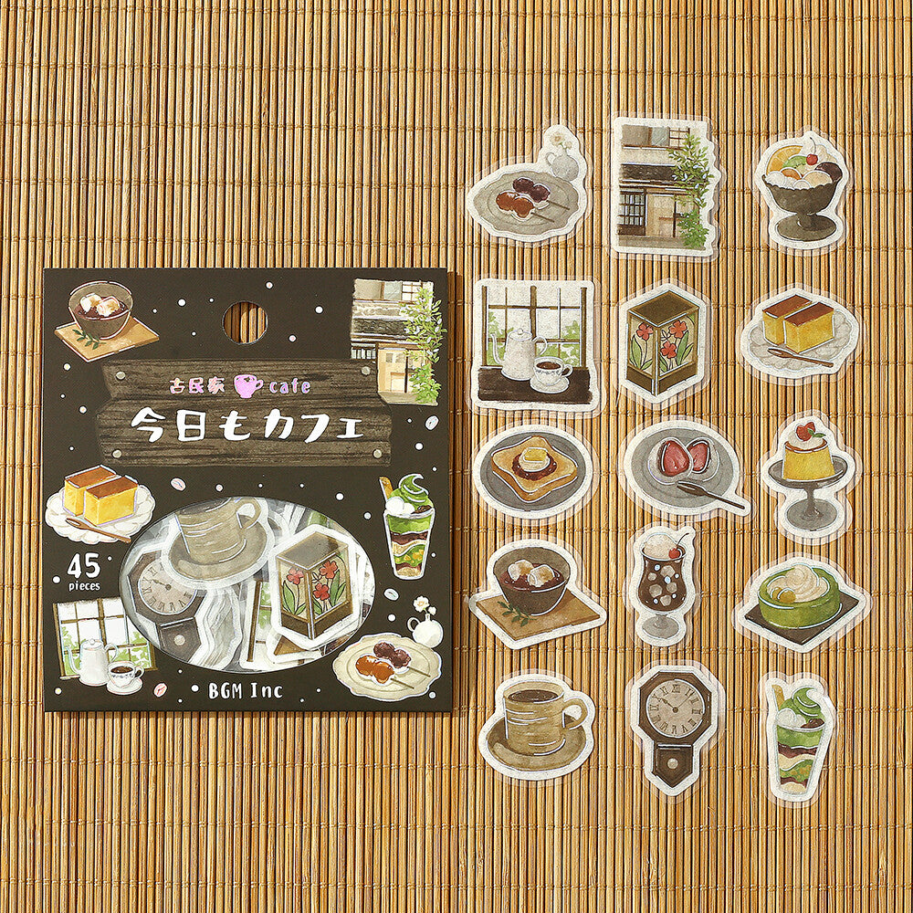 Set of illustrated stickers featuring coffee-themed graphics on a bamboo mat background