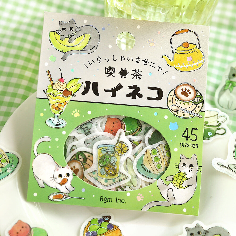 Pack of stickers with cat-themed designs on a green and white checkered background