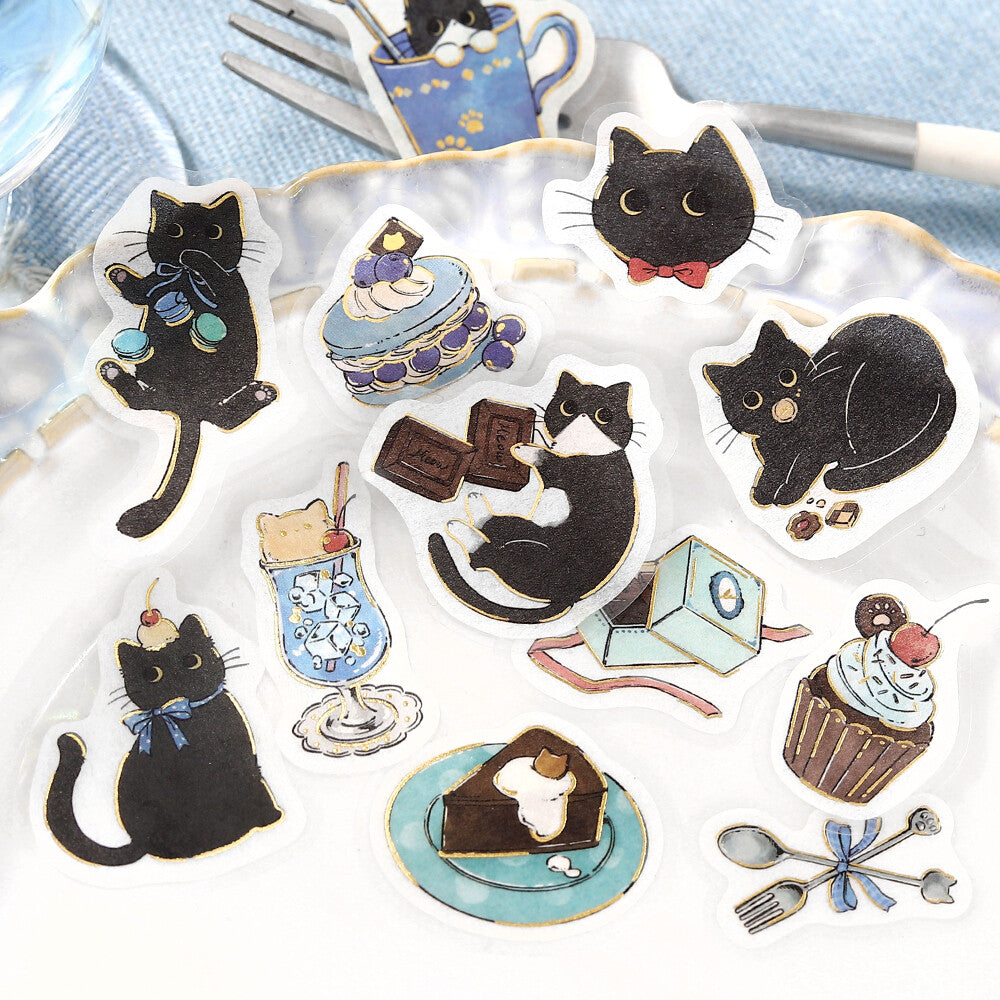 Set of black cat-themed stickers on a white background