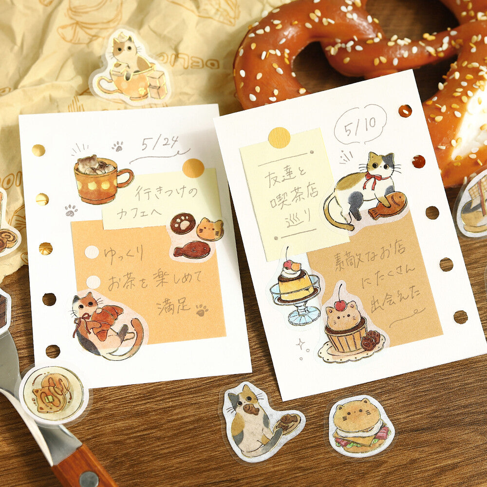 Sticker sheets with cute animal illustrations and text on a wooden surface.