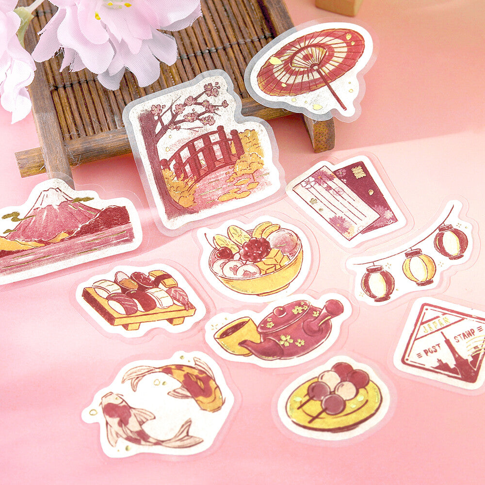 Set of decorative stickers with Japanese-themed illustrations on a pink background.