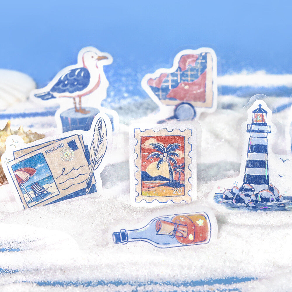 Set of decorative stickers featuring a seagull, lighthouse, postage stamps, and a bottle with a message on a sandy background.