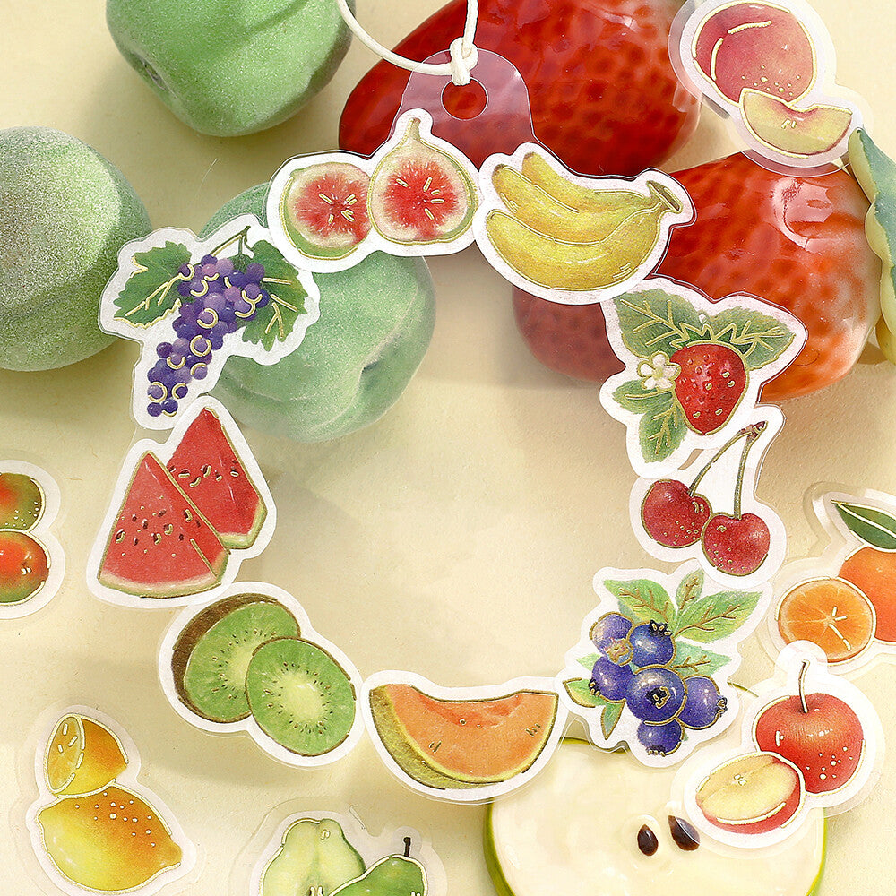 Colorful fruit-themed decorative items on a light background