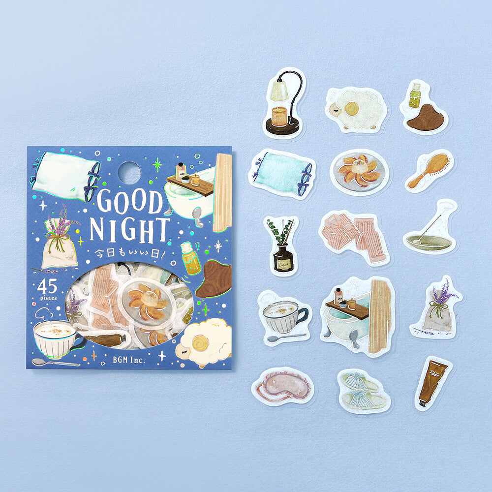 A set of night themed stickers displayed next to their packaging on a pale blue background. 
