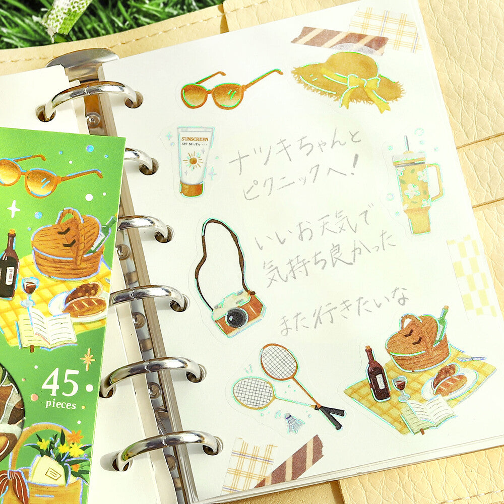 An open page of a ring binder showing stickers used for decoration 