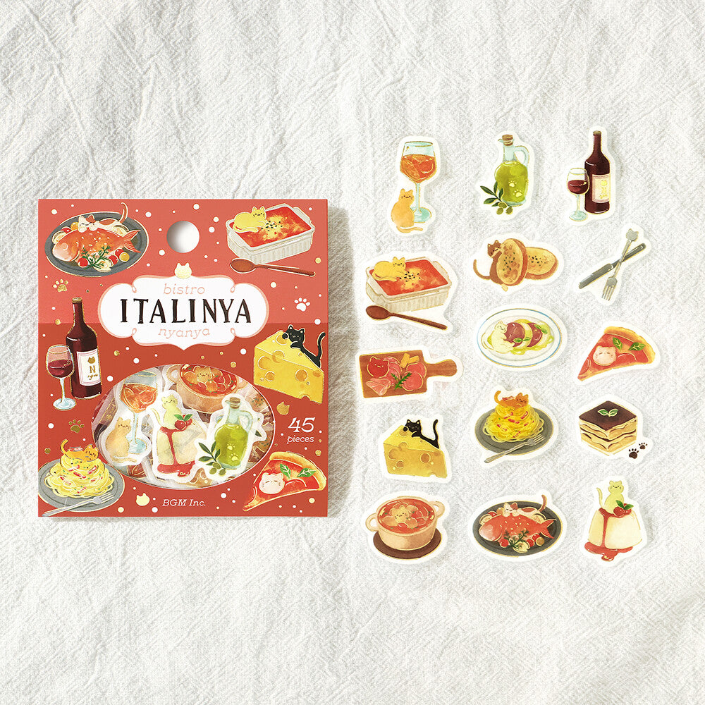 A collection of Italian cuisine stickers with various food motifs arranged on a white checkered fabric surface

