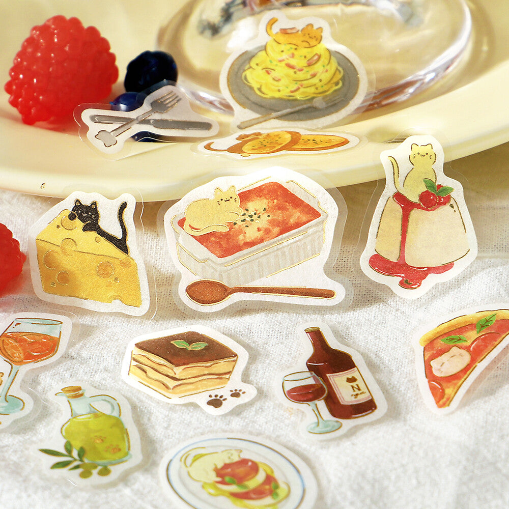 A close-up of cute illustrated stickers, surrounded by more matching sticker designs on a napkin surface.
