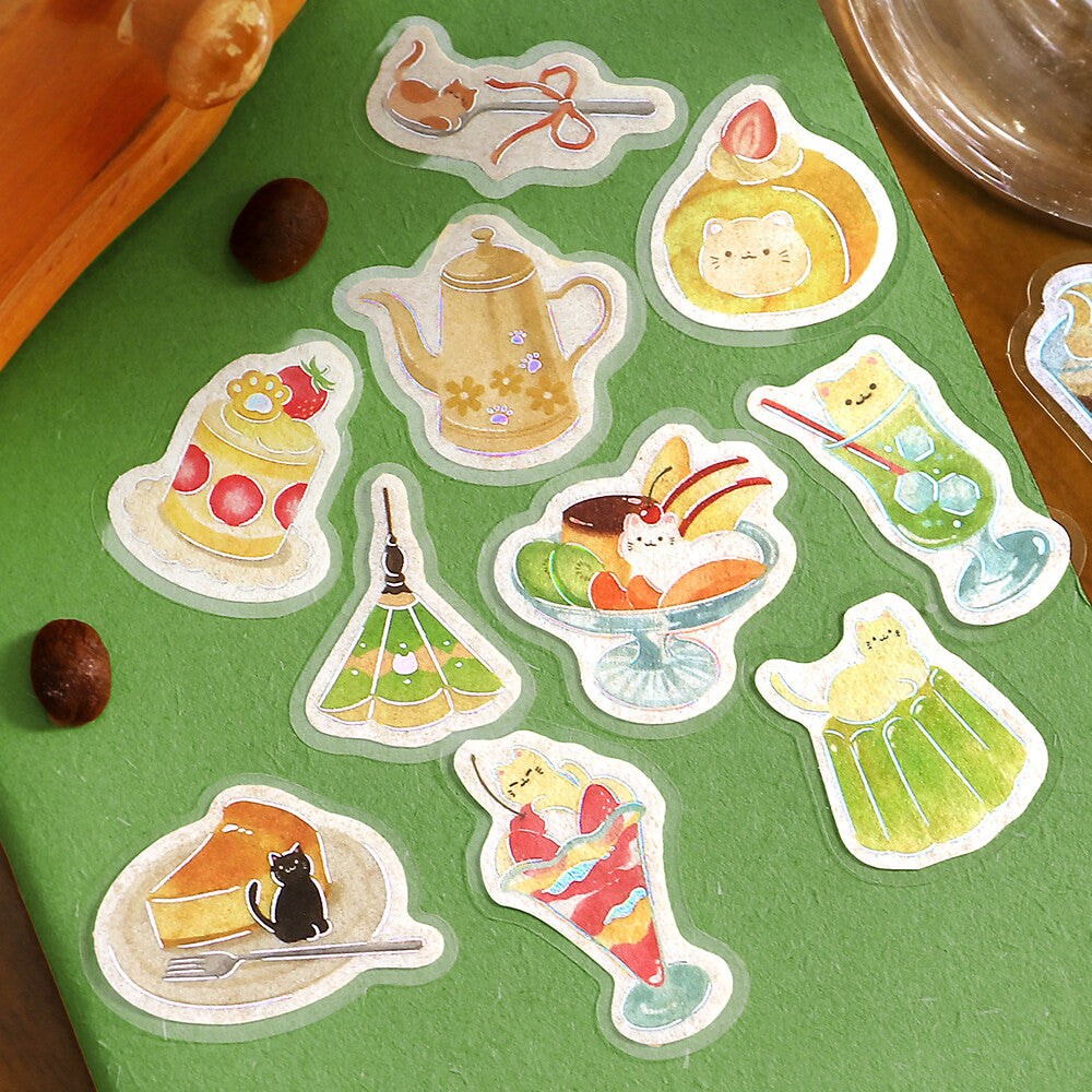 A collection of cafe and dessert themed stickers on a green paper background