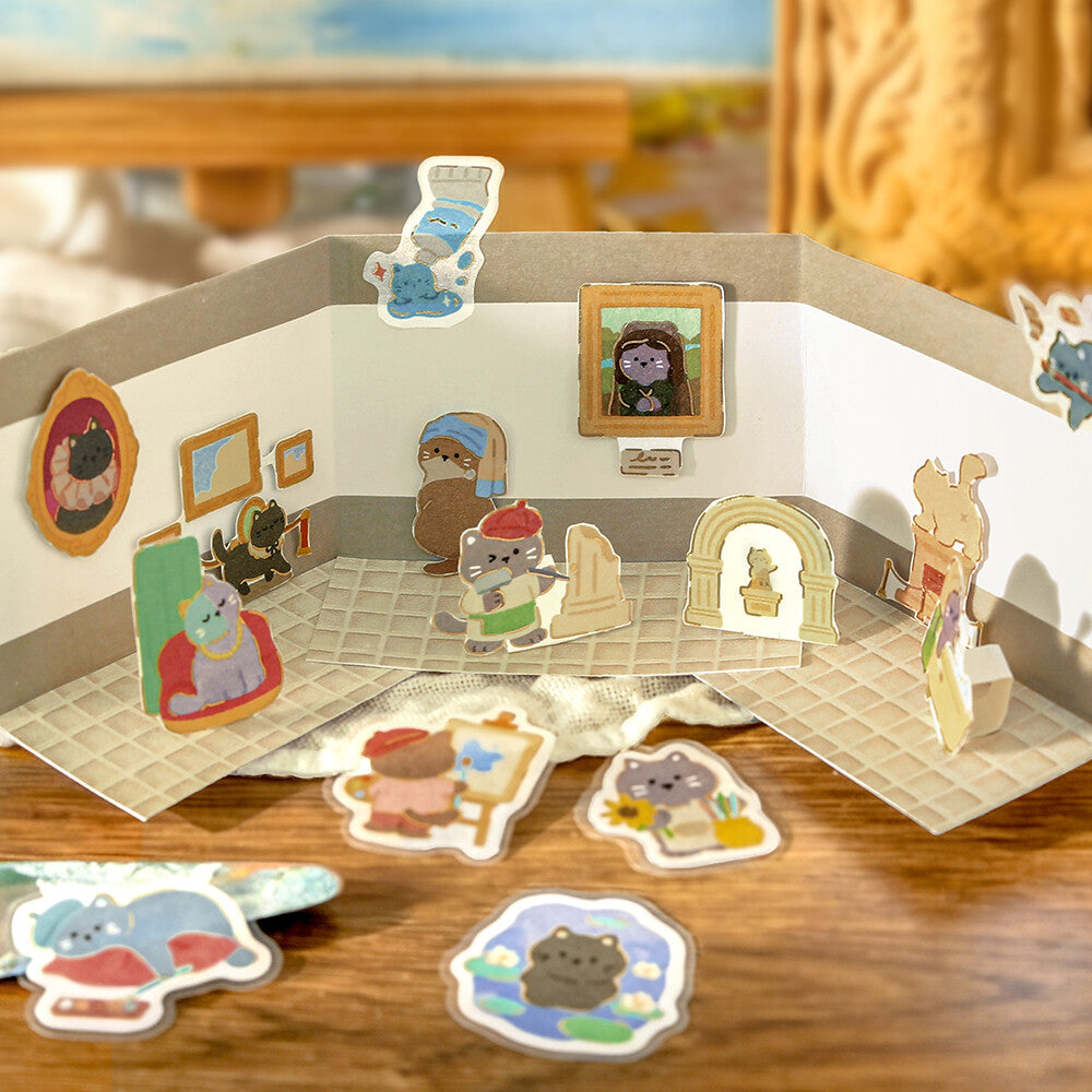 Diorama of cats with stickers to show a visual story
