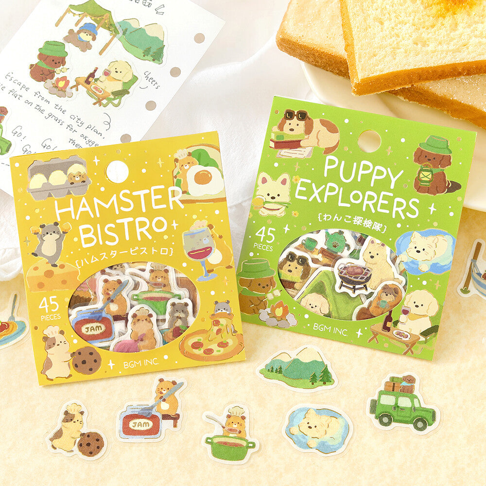 Two packets of BGM stickers on a paper background