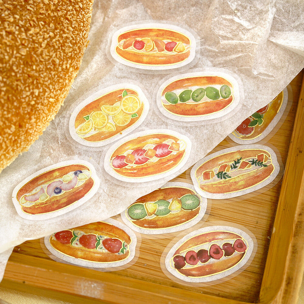 Illustrated hot dog buns with various toppings on a wooden surface
