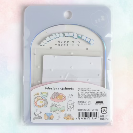 A packaged sheet of sticker-like decorative pieces with a clear plastic sleeve and printed backing card. The product shows pastel illustrations, Japanese text, and a barcode, photographed against a plain light background.