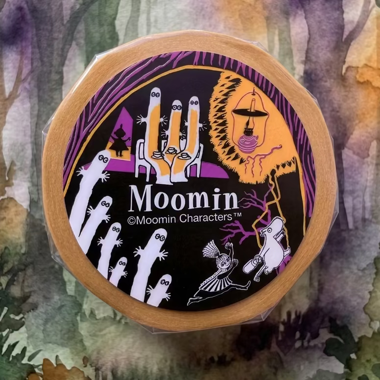 Washi tape roll of Moomins with yellow and purple colours on white background