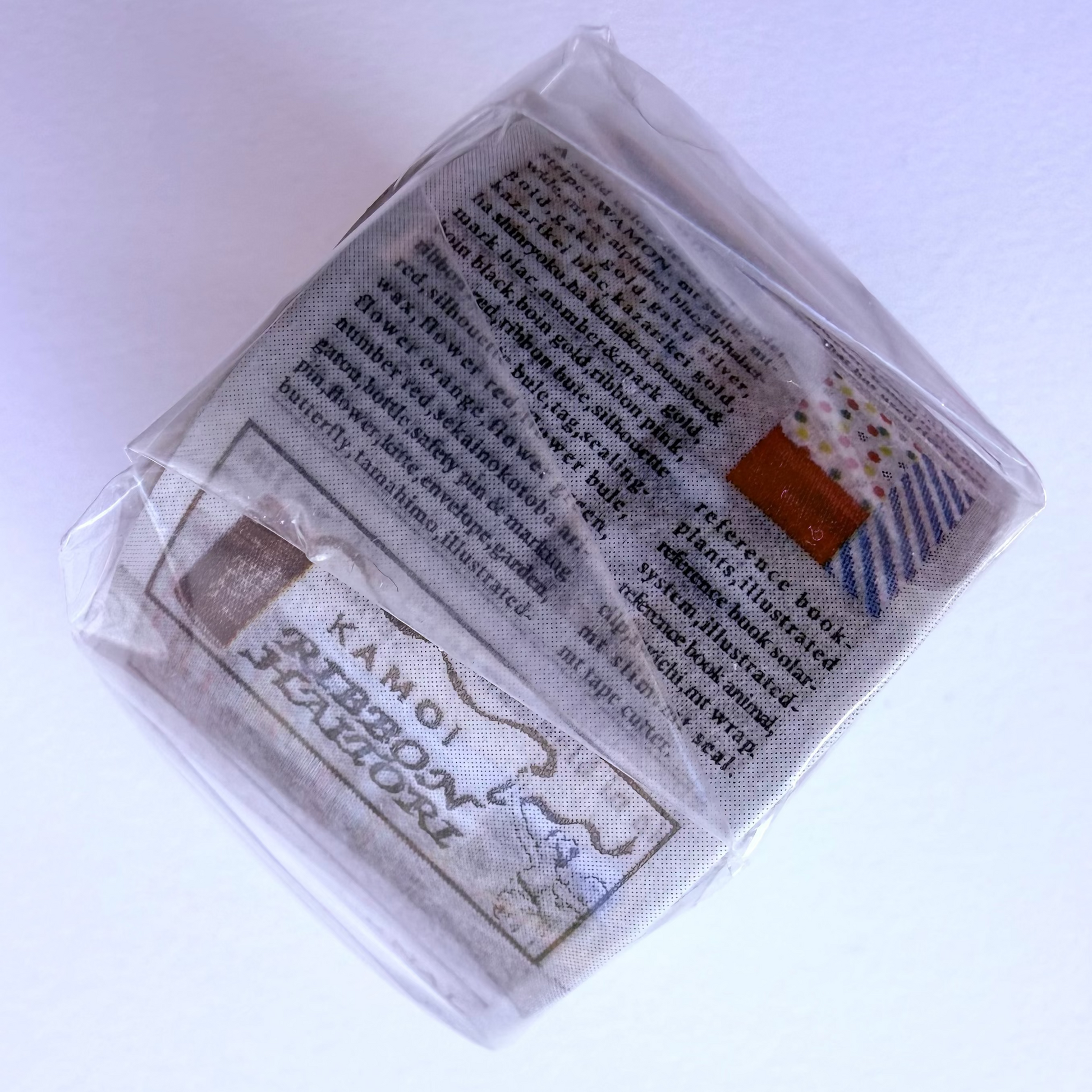 Washi tape side with newspaper theme on white background