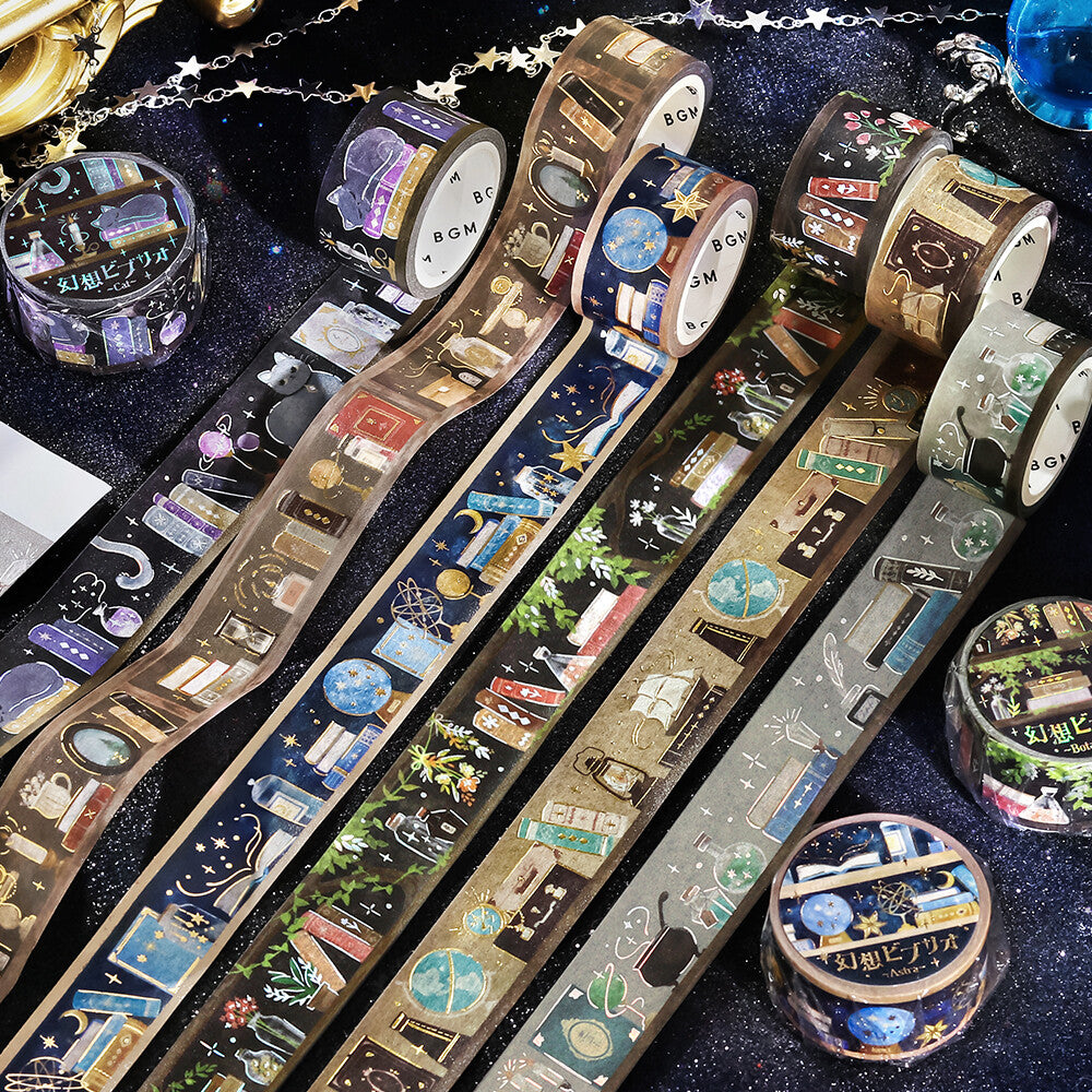 Decorative tape rolls with various designs on a dark background
