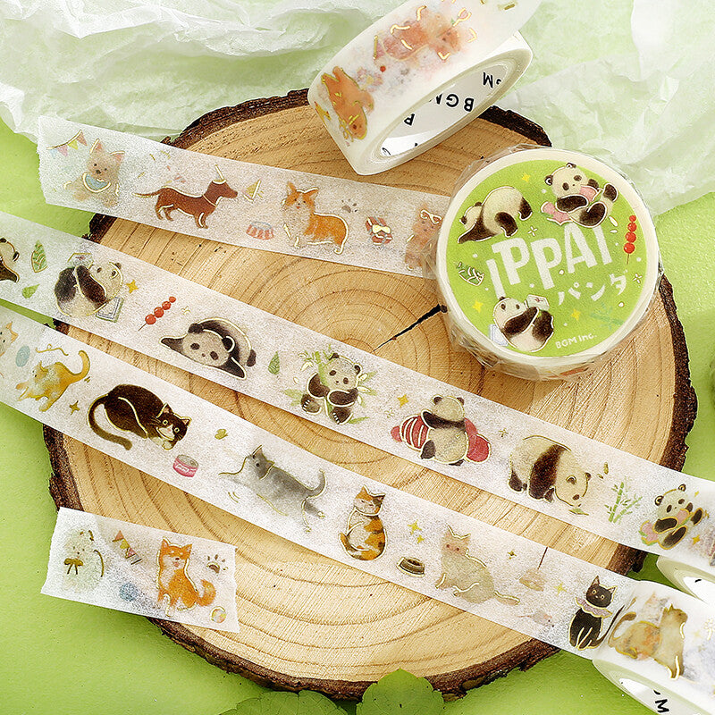 Roll of BGM washi tape featuring pandas and dogs in cute poses on green and wood  background