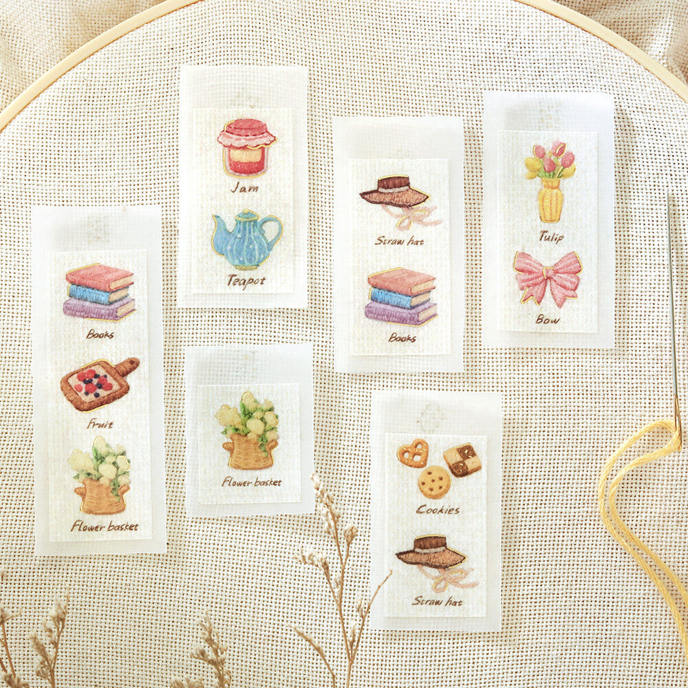 Set of small cards with illustrations and text on a textured fabric background