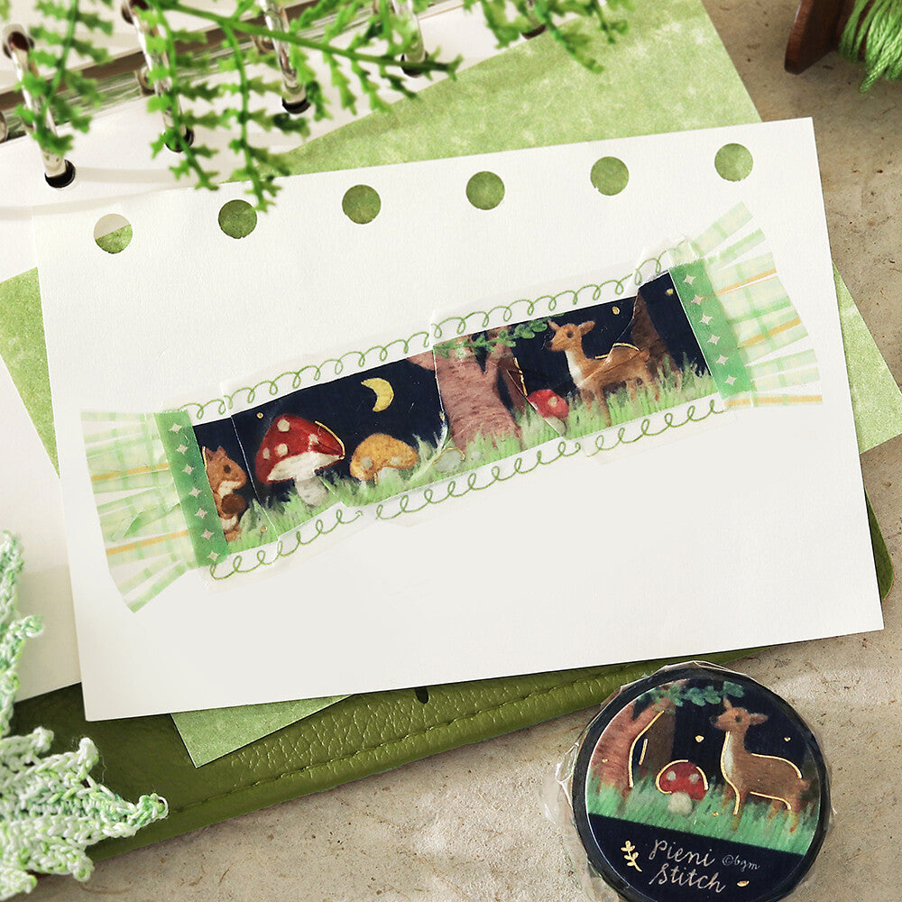 Woodland-themed product with deer, mushrooms, and night sky design on a white card with green border.