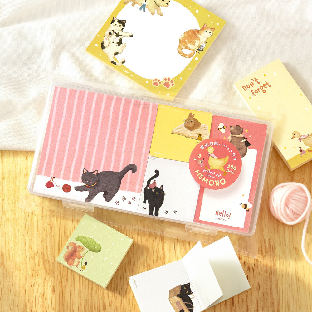 A packet of decorative memo pads in a clear package on a wood surface