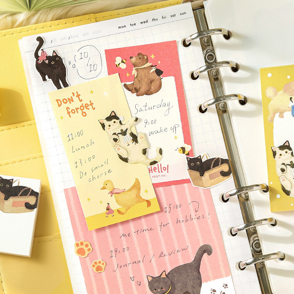 An open binder with cute memo pads with animal themes