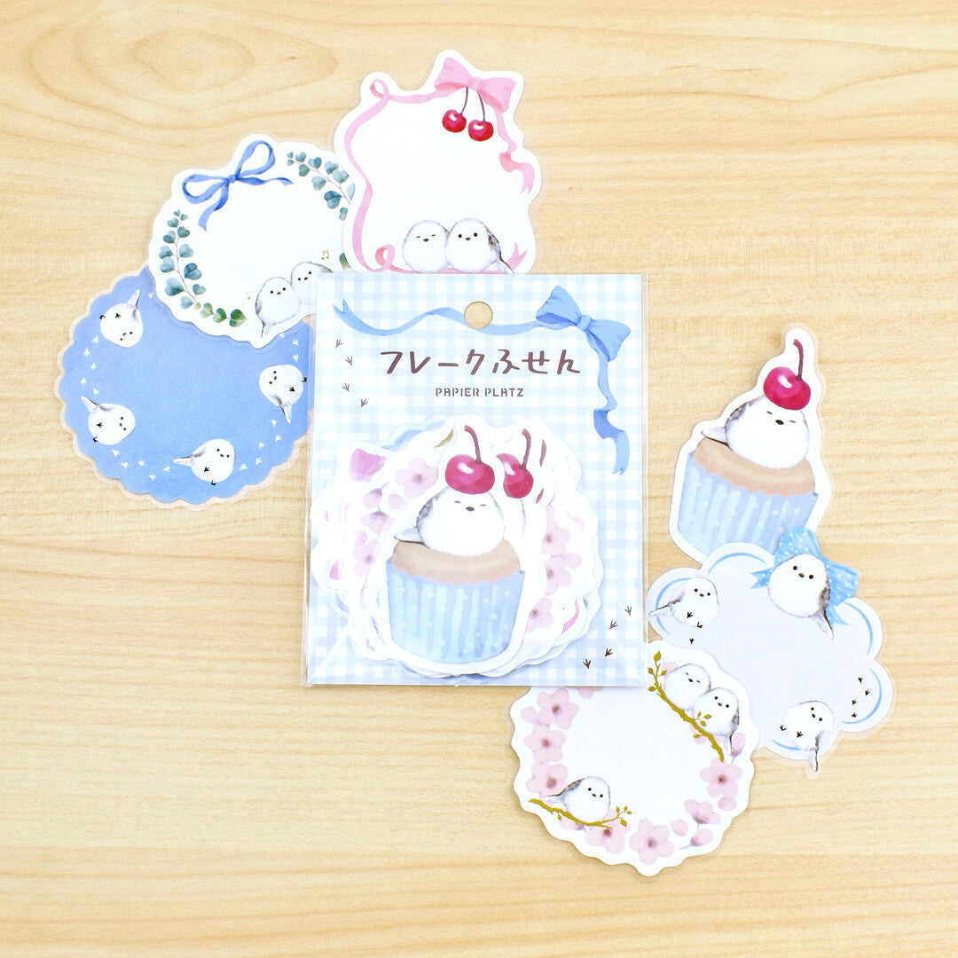 Set of cute animal-themed stickers on a wooden surface