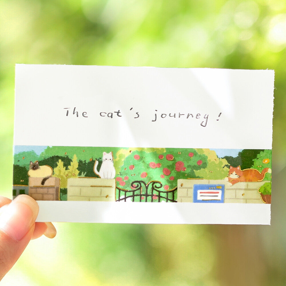A card with a cat illustration on washi tape