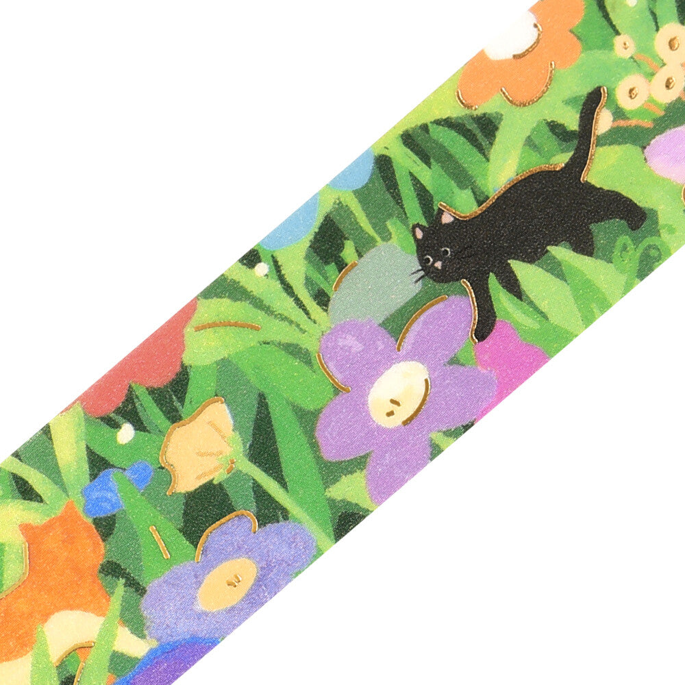A washi loop showing a design of a black cat amongst a garden bed