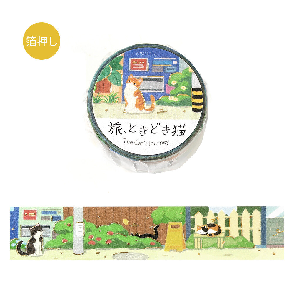 A roll of decorative tape wrapped in clear plastic with a circular label reading 'The Cat's Journey,' shown above an unwrapped strip of the same design. The tape features cat silhouettes sitting on benches on the street
