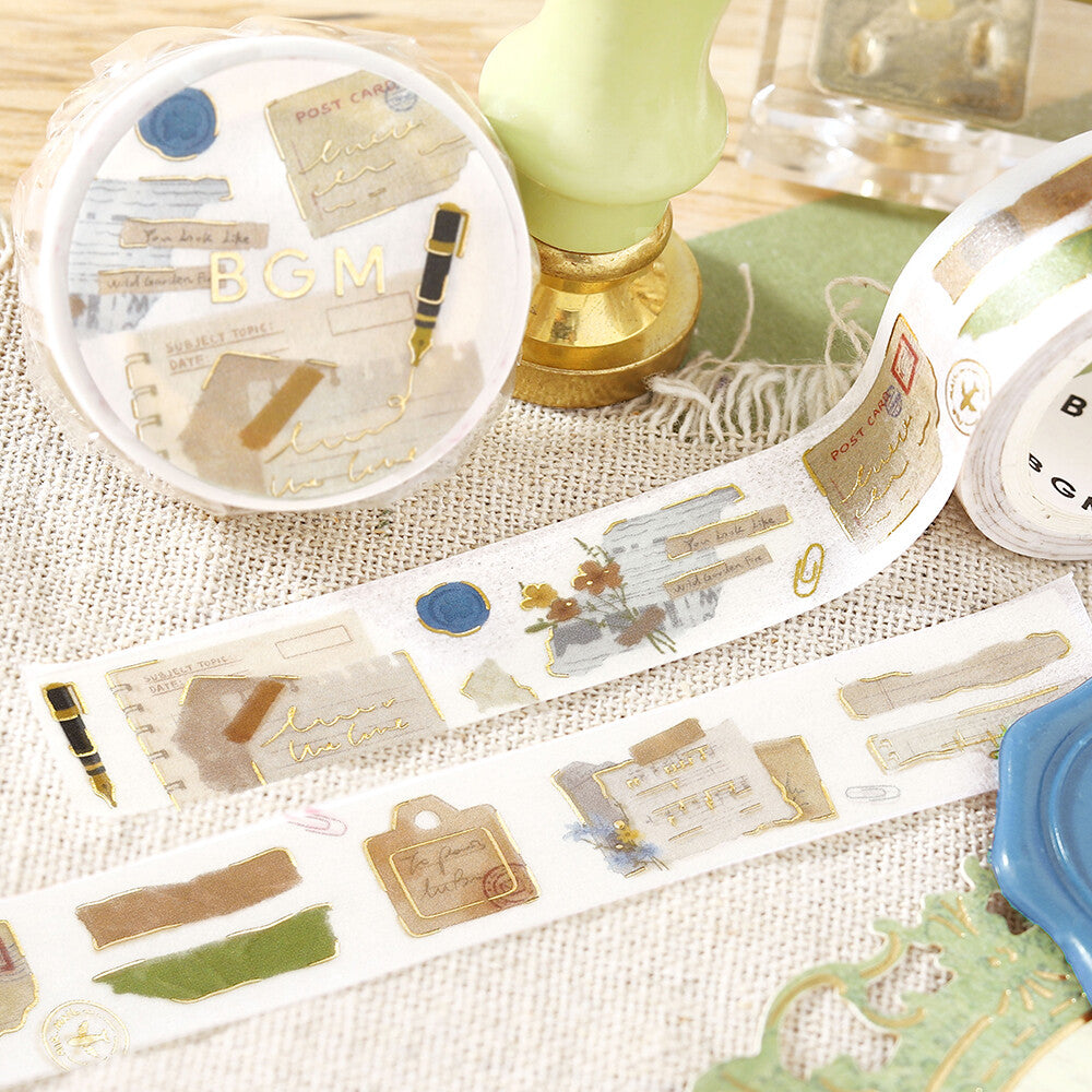 Decorative washi tape with vintage design on a textured surface