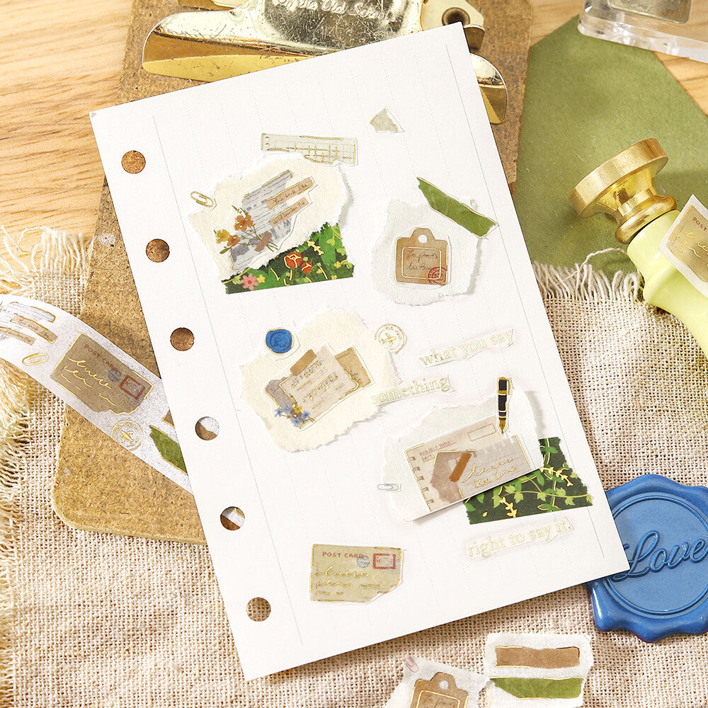 Sheet of decorative stickers with various designs on a textured surface.