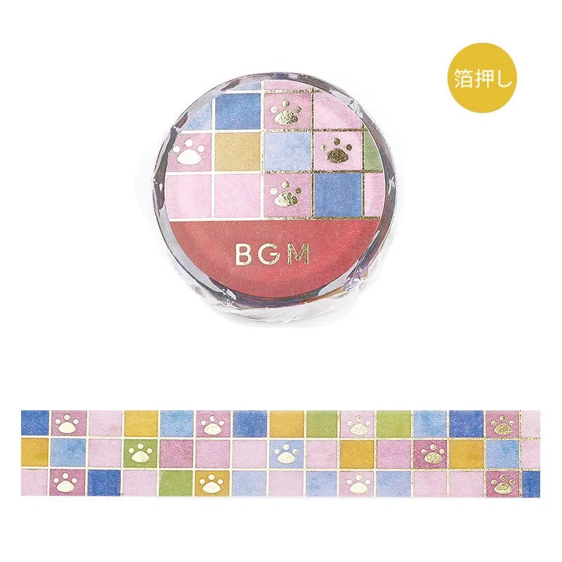 BGM washi tape with tile art design and gold foil dog paw prints on a white background