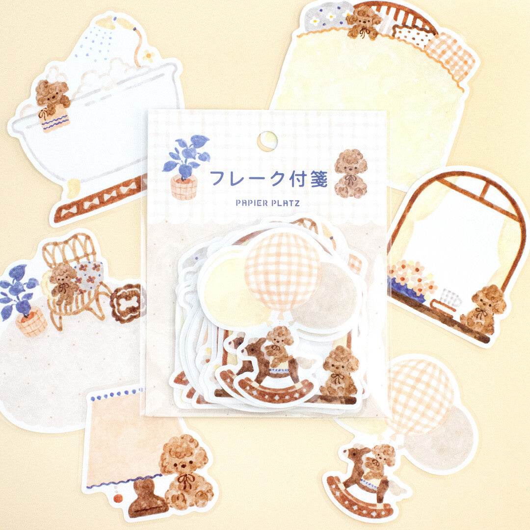 Set of decorative stickers with teddy bears and other designs on a beige background