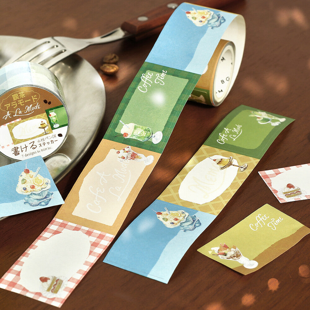 Roll of decorative paper with cute animal designs on a wooden surface