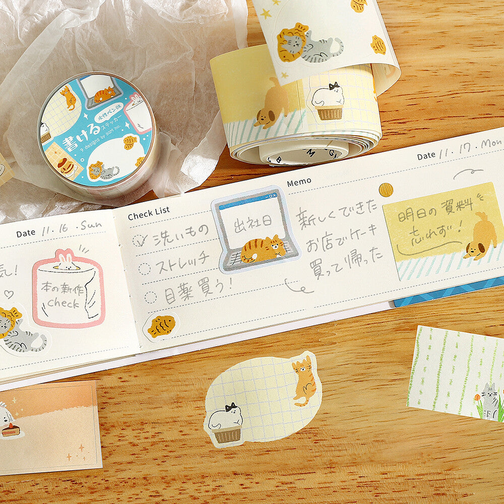 Decorative washi tape with animal designs on a wooden surface