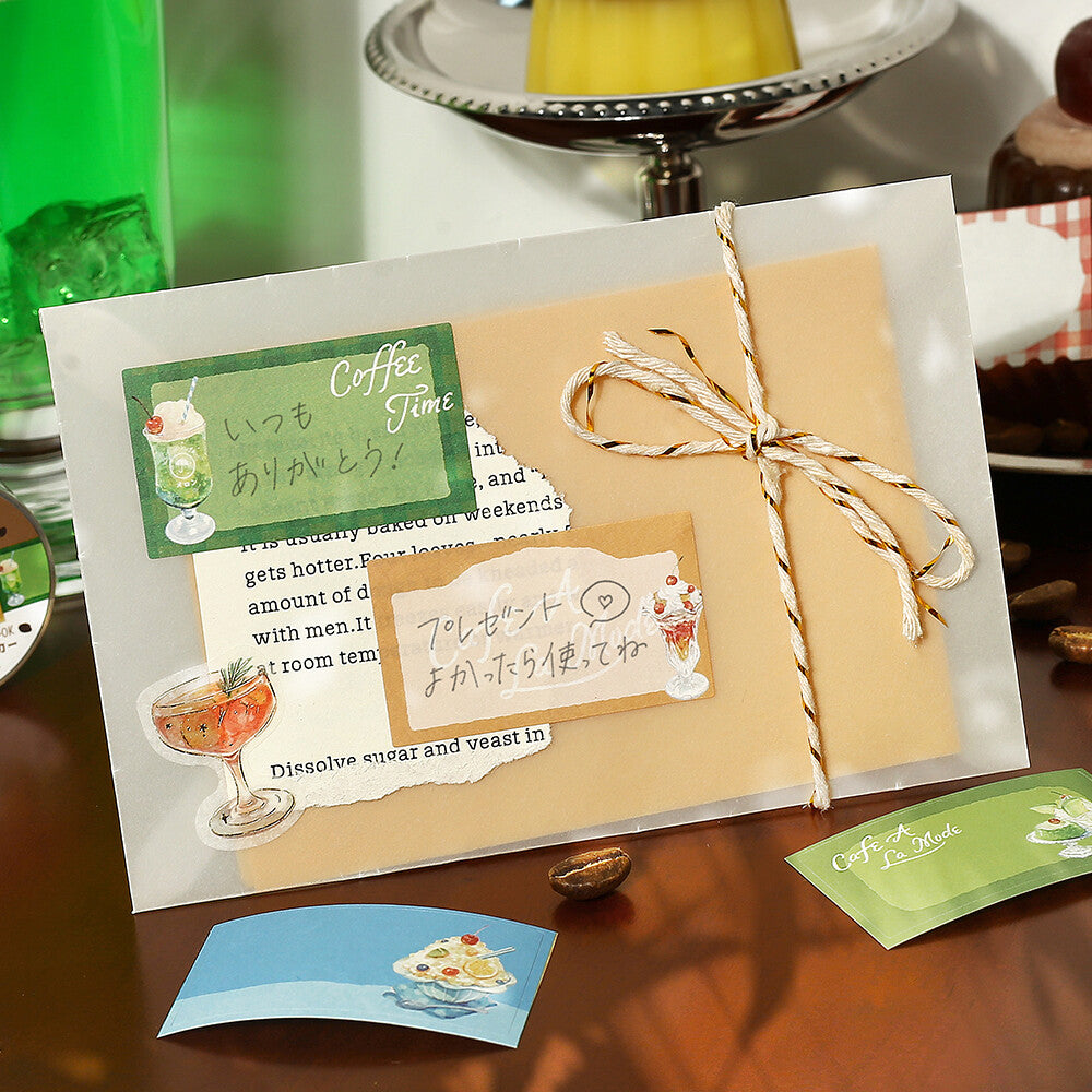 Gift card with Japanese text and illustrations on a wooden surface