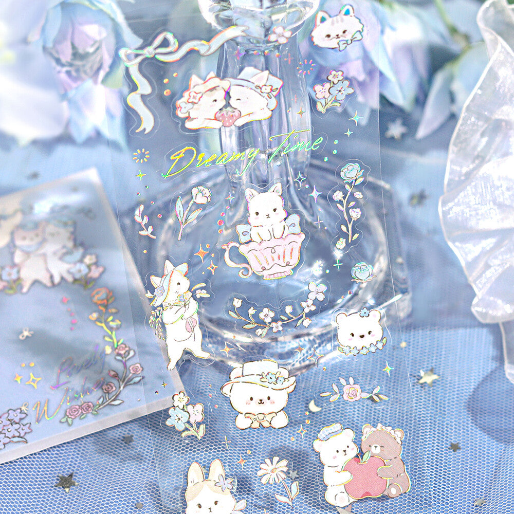 Packaged stickers with cute animal designs on a blue tulle background