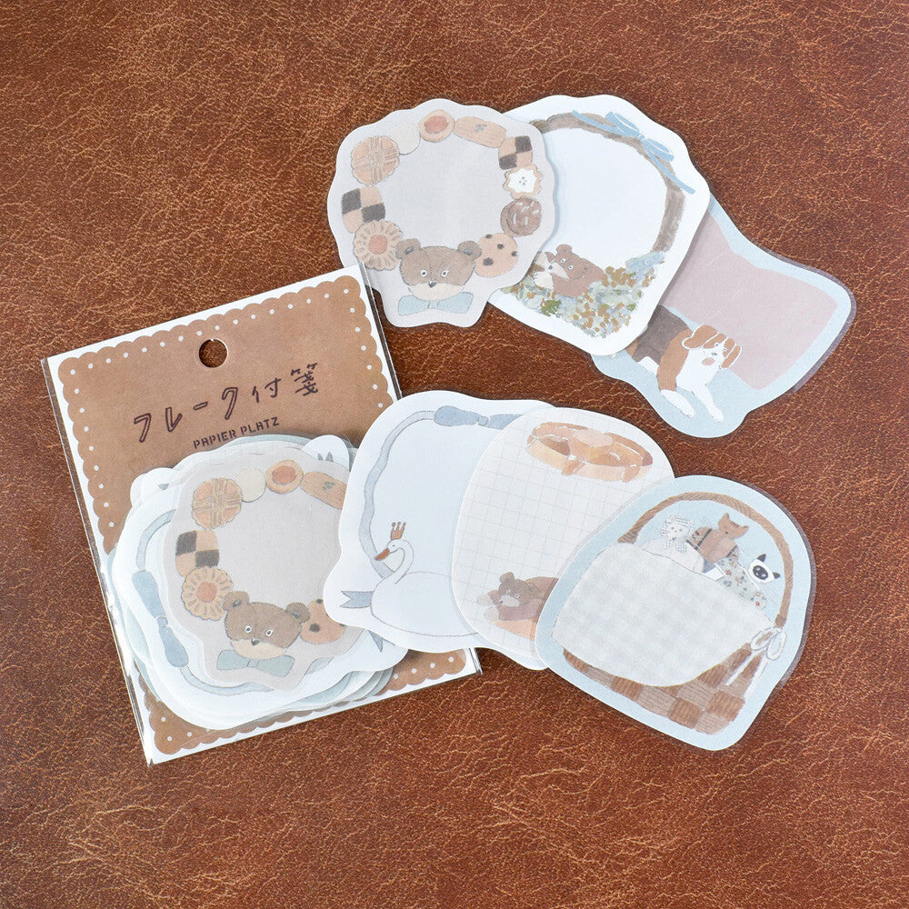 A packet a paper stickers with bear and animal motifs on a leather background