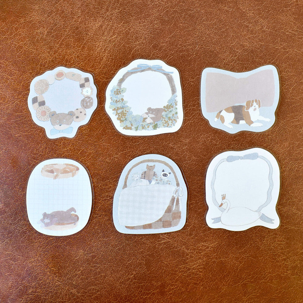 Set of six animal-themed stickers on a brown leather background