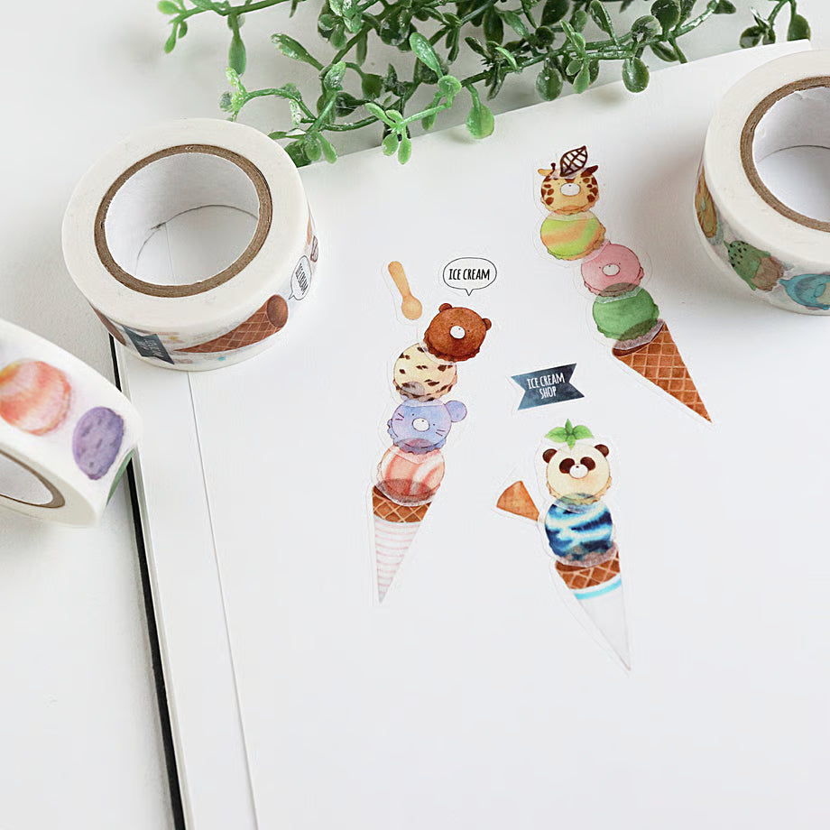 Decorative tape with ice cream-themed stickers on a white surface with greenery.